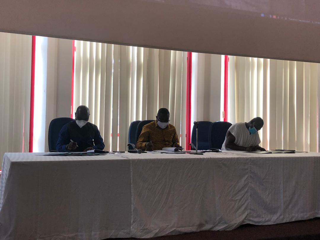 Alhaji Yahaya Zakaria Osman (left), Mr Kwasi Adu-Gyan (middle) and Dr Ibrahim James Gurindow signing the agreement