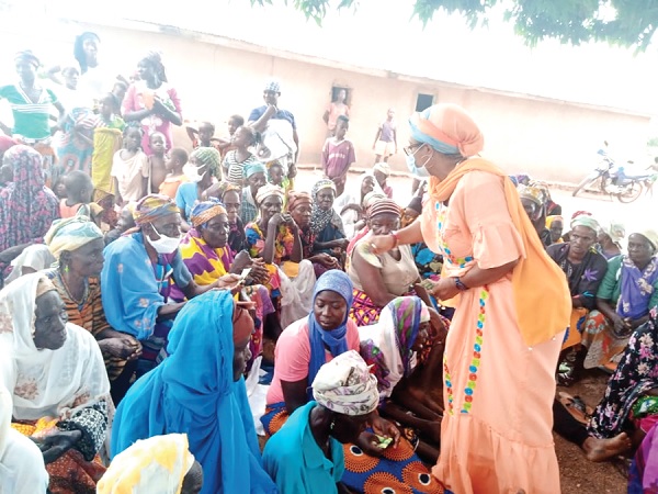 The Minister of Gender, Children and Social Protection, Mrs Cynthia Mamle Morrison, interacting with some of the people at the Gnani  witches camp