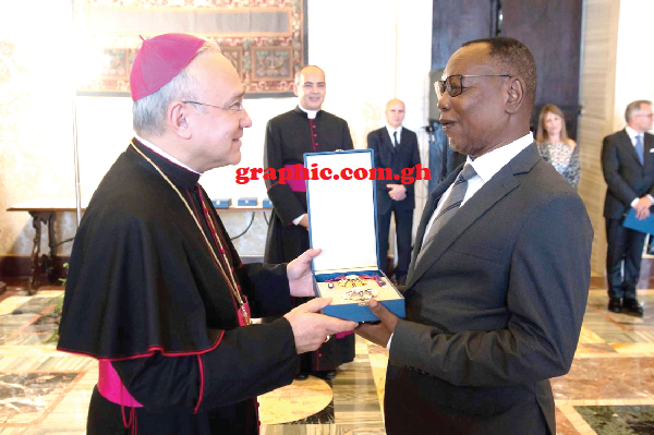 Archbishop Edgar Pena Panna (left) Substitute for General Affairs of the Vatican Secretariat of State, presenting the Award to Ambassador Joseph Akudibillah