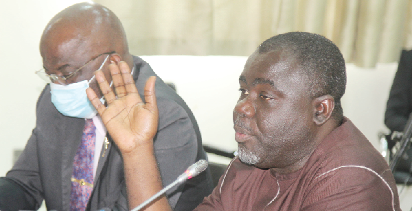 Mr. Kwaku Ofori Asiamah (right), Minister of Transport, answering questions before the Public Accounts Committee in Accra. With him is Mr Thomas Alonsi (left), Director-General of the Ghana Maritime Authority. Picture: GABRIEL AHIABOR