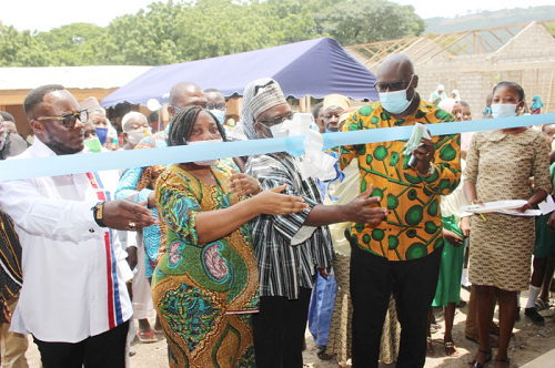 Mr Daniel Akuffo, DCE for Shai Osudoku, (2nd right), Mr Obiri-Yeboah, representative of Educational Charity Foundation for Ghana (middle), ms Mercy Keteku (2nd left), representative of the District Education Officer, Mr Benjamin Nargah, NPP Parliamentary candidate (left) cutting a ribbon