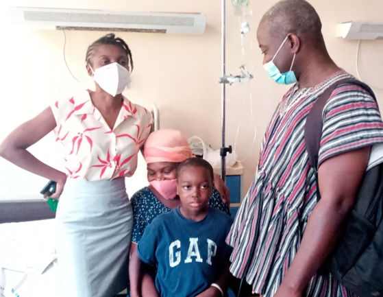 Dr Amoako (left) on her routine checks with Ezra and mother