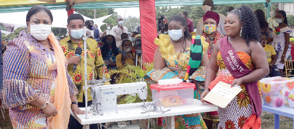 Mrs Rebecca Akufo Addo (left) presenting some start up kits to one of the beneficiaries. Picture: NII MARTEY M. BOTCHWAY