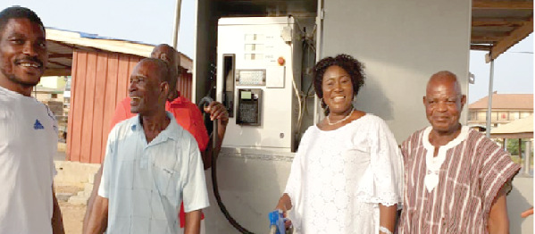 Mrs Elizabeth Afoley Quaye  (2nd right) with some fisheries sector stakeholders after inspecting the new automated machine 