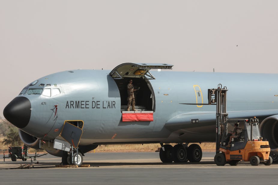 French Air Force soldiers work on a Boeing C135 parked on the French Air Force base in Niamey, Niger in December, 2017.