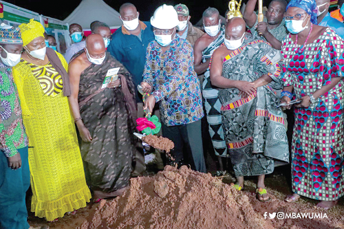 Dr Mahamudu Bawumia assisted by some chiefs to the cut sod for the construction of the roads