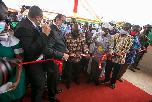President Nana Addo Dankwa Akufo-Addo being assisted by Dr Said Deraz (3rd left) and Mr Kwaku Agyemang-Manu (3rd right), the Minister of Health, to cut a tape to inaugurate the Ahafo Ano  Municipal Hospital at Tepa. With them are Dr Owusu Afriyie Akoto (2nd right), the Minister of Agric, and Nana Agyemang Prempeh (right), the National Coordinator of NADMO.