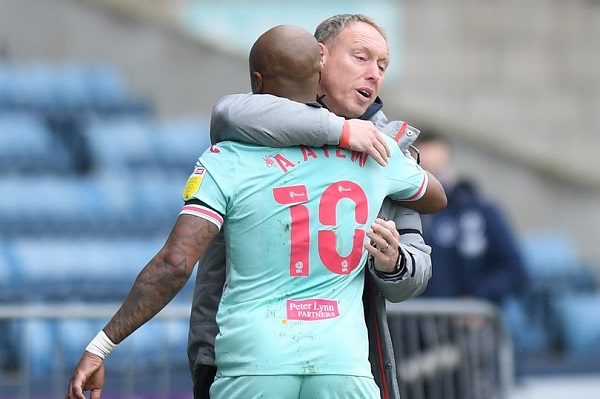 Andre Ayew of Swansea City celebrates scoring the opening goal with Steve Cooper