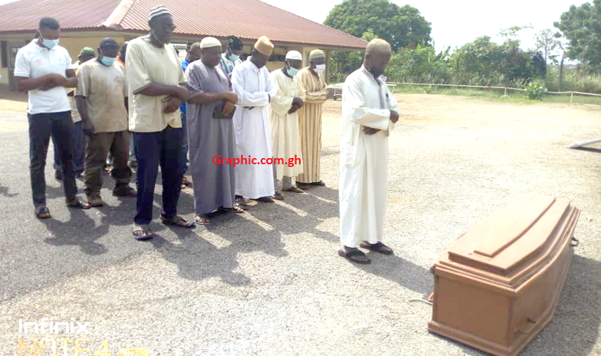  Muslim prayers being offered for the deceased before his re-burial