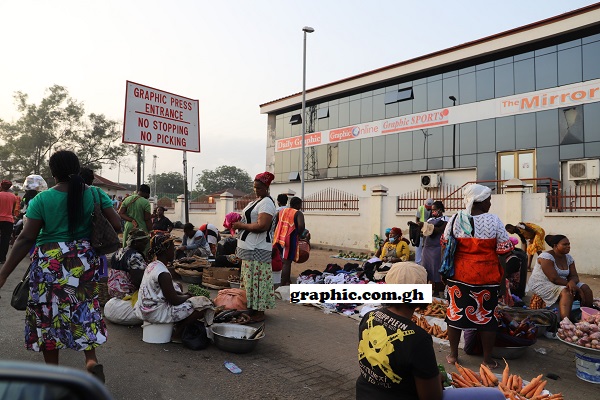 Traders and hawkers spill over onto the pavement and street in front of the Graphic Press House. Pictures: GABRIEL AHIABOR