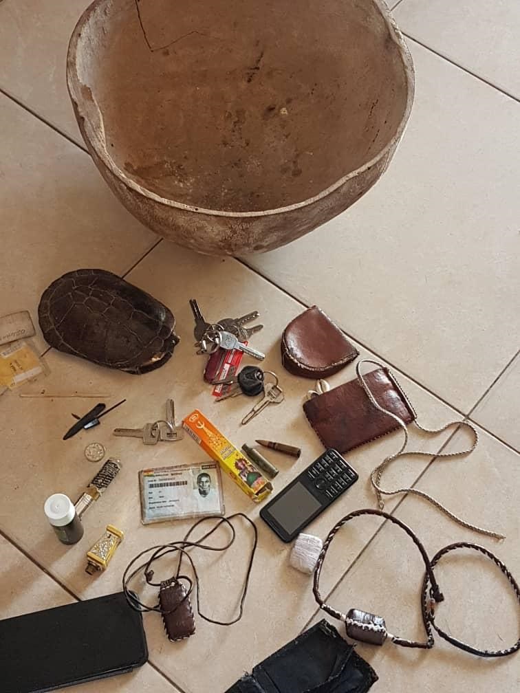 A tortoise and some items including a talisman were found at the scene where the suspected robber was killed