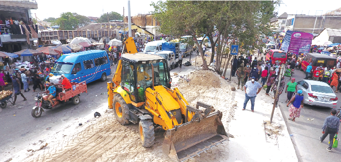  Mr Henry Quartey (arrowed), the Greater Accra Regional Minister, supervising the clearing of concrete platforms in the median on the Kwame Nkrumah Avenue leading to the Kantamanto Market. Picture: DOUGLAS ANANE-FRIMPONG