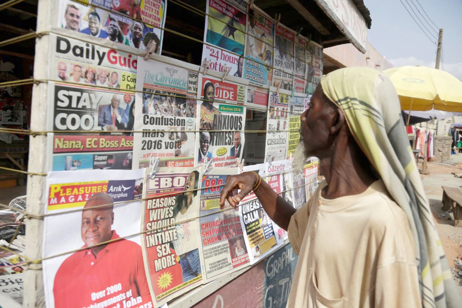 A passer-by at the newsstand