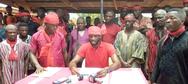 Mr Michael Teye Sackitey (seated), the spokesperson for the Dedeso-Wereko settlers, flanked by the various community leaders, laying out their concerns at the press conference
