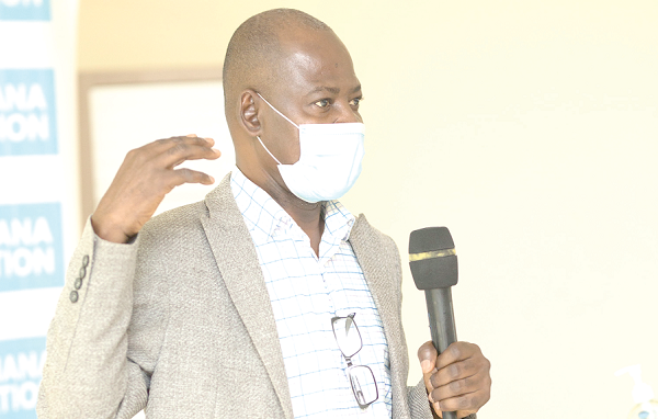 Dr Steve Manteaw (left), Chairman, Civil Society Platform on Oil and Gas, making a presentation 