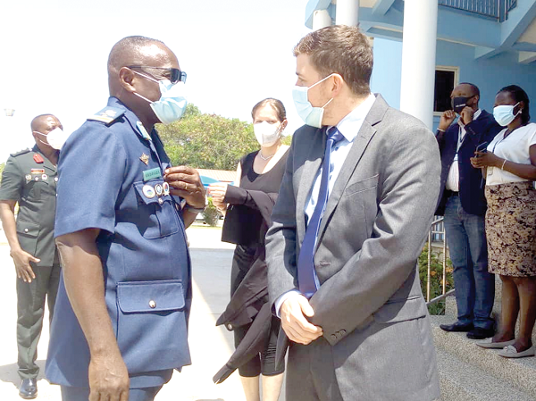 Air Commodore George Arko-Dadzie (left), Deputy Commandant of the Kofi Annan International Peacekeeping Training Centre, interacting with Mr Moritz Fischer, Political Attache at the German Embassy