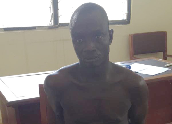 Suspect Papa Gyebi, in the custody of the police in Shama