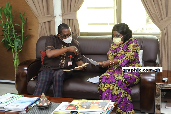 Mr Kobby Asmah (left), the Editor of the Daily Graphic, presenting a concept document on the Graphic Sanitation Project to Ms Cecilia Abena Dapaah, the Minister of Sanitation and Water Resources. Picture: DOUGLAS ANANE-FRIMPONG