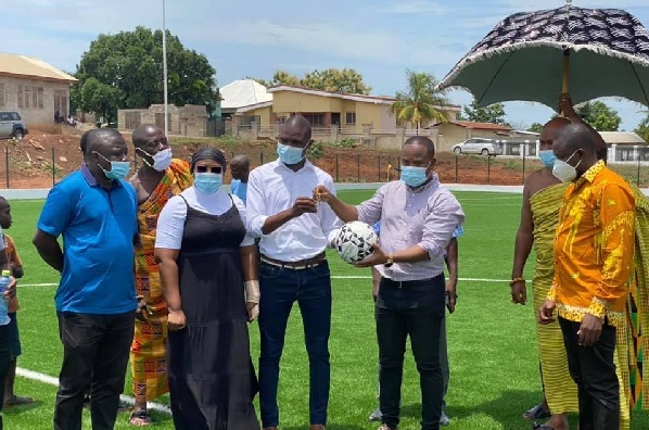 Mr Eddie Dankwa (3rd right) handing over the keys to the facility to Mr Dominic Eduah of GNPC