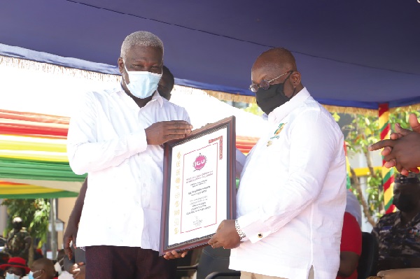 President Akufo-Addo presenting a citation to Mr Solomon Kotei (left), the General Secretary, Industrial and Commercial Workers Union. Picture: SAMUEL TEI ADANO