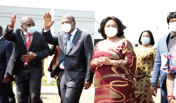 Mr Joao Manual Goncalves Lourenco (2nd left), the President of Angola, responding to cheers from the Angolan Community in Ghana at the Jubilee Lounge of  the airport in Accra. Picture: SAMUEL TEI ADANO