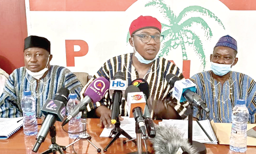 Mr Awudu Ishaq (middle), National Communications Secretary, PNC  addressing the media. With him are Mr David Apasera (left), leader of the party, and Mr Moses Dani Baah (right), National Chairman