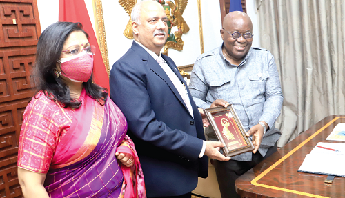  President Akufo-Addo receiving a gift from Mr Shekhar Mehta, President, 2021-2022 Rotary International, and his wife at the Jubilee House. Picture: SAMUEL TEI ADANO
