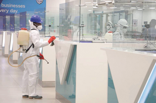 A Zoomlion staff disinfecting booths at the KIA 