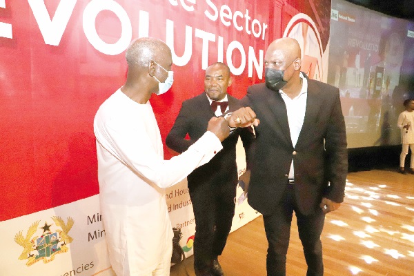 Mr Ato Afful (right), MD, Graphic Communications Group Limited, with Uncle Ebo Whyte (left), a playwright, after the launch of  the Real Estate Revolution in Accra. Looking on is Rev. Elvin Nunoo Larkai, MD of Elrano Projects and Consult.  Picture: Gabriel Ahiabor