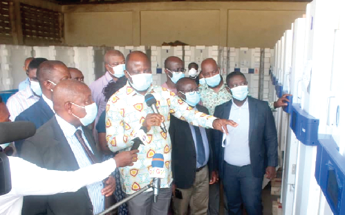  Mr. Kwaku Agyeman-Manu (left), the Minister of Health, being briefed on the storage systems