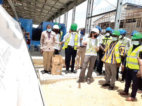 Miss Annelies De Beule (3rd-right), the Project Coordinator, explaining the scope of work to Mr Stephen Yakubu (2nd right), the Upper East Regional Minister, and Mr Amidu Issahaku Chinnia (right), Deputy Minister of Sanitation and Water Resources