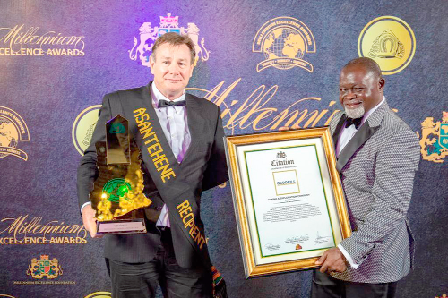 Mr Dave Harper, Chief Executive Officer of  Geodrill Limited, and Mr Azumah Nelson, a boxing legend, displaying the Millennium Excellence Award won by the company