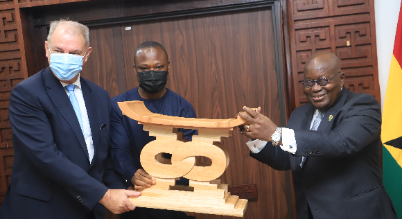 President Nana Addo Dankwa Akufo-Addo (right) presenting a gift to Mr Augustine Da Silva Cunha (left), the outgoing Angolan Ambassador to Ghana, at the Jubilee House yesterday
