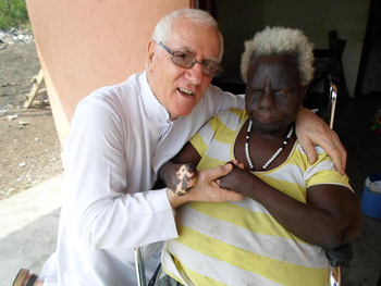 Rev. Fr. Andrew Campbell posing with one of the inmates at the Weija Leprosarium 