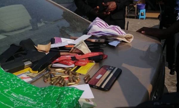 A pistol, bullets and other items taken from the suspected robbers