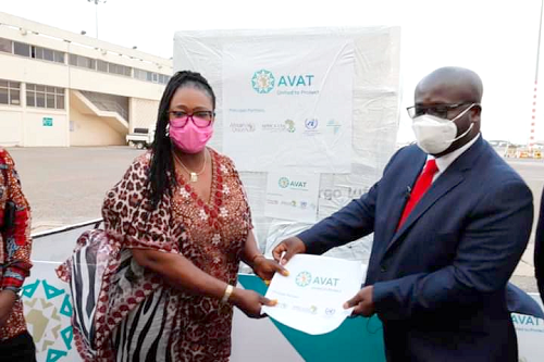 Ms Tina Mensah (left), a Deputy Minister of Health, receiving the vaccine from Mr Kwabena Ayirebi, a representative of AVAT. Inset: A sample of the Janssen vaccine 