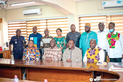 Mr Alan Kyerematen (seated 2nd left), Minister of Trade and Industry; Dr Owusu Afriyie-Akoto, (seated 3rd left), Minister of Agriculture, with members of the committee 