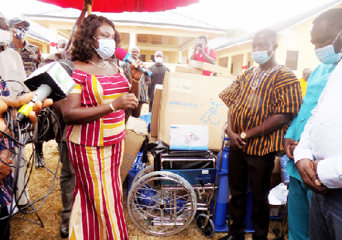 Mrs Gifty Agyare-Danso (left) handing over the medical equipment to officials of the Asene District Health Directorate