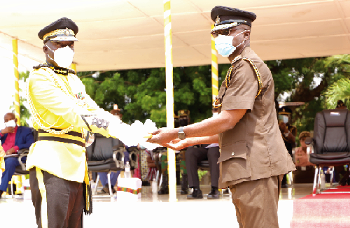 Mr Patrick Darko Missah (left), outgoing Director-General of Prisons, transferring a key as a symbol of authority to Mr Isaac K. Egyir (right), acting Director-General of Prisons, during the ceremony. Picture: EDNA SALVO-KOTEY