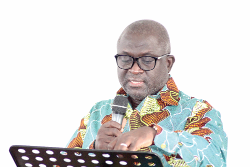 Mr Samuel Nii Adjei Tawiah (right), the Chief Executive of KOKMA, addressing the assembly’s general meeting