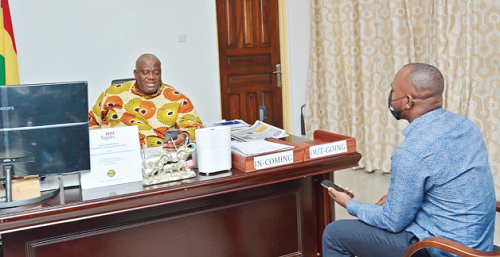 Mr Henry Quartey (left), the Greater Accra Regional Minister, in a chat with Joshua Bediako Koomson, a Daily Graphic reporter