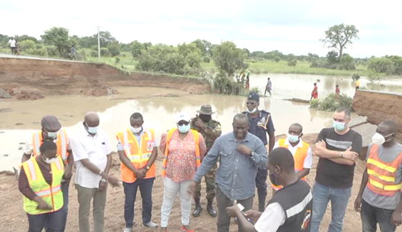 Dr Hafiz Bin Salih (arrowed), the Upper West Regional Minister, with members of the REGSEC assessing the impact of the flood at one of the sites 