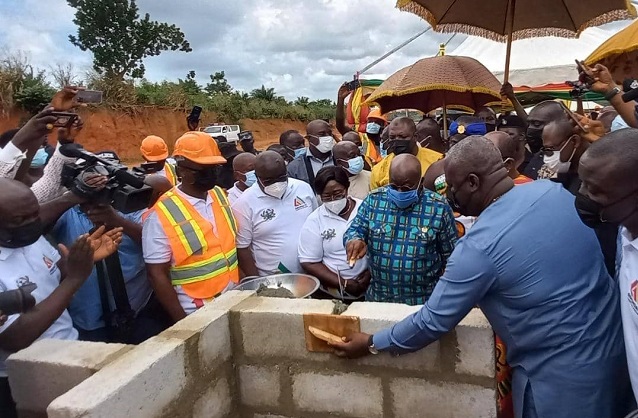 President Akufo-Addo is assisted to lay foundation blocks for the new district hospital