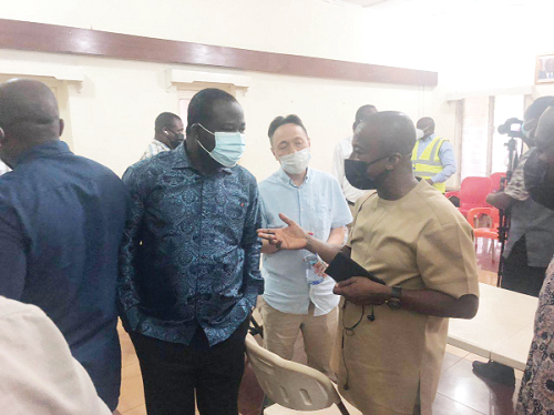Mr Isaac Ofori-Poku (right ), Board Chairman of the GBC, having a discussion with Mr Alfred Obeng-Boateng (left), the MP for the area, and Mr J.K. Fang, the General Manager of the GBC, after the crisis meeting