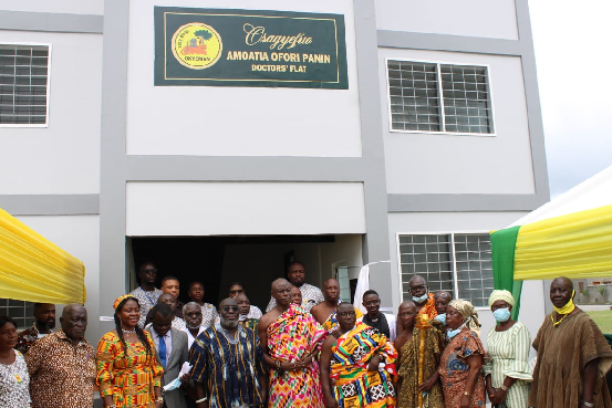 • Some officials in front of the accommodation facility for the medical officers
