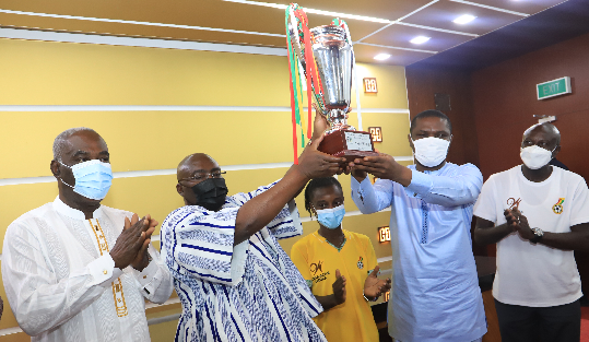 • Vice-President Dr. Mahamudu Bawumia (2nd left) together with Mr. Mustapha Ussif (2nd right), Minister of Youth and Sports, lifting the trophy. With them are Miss Janet Egyir (3rd left) and some officials. Picture: SAMUEL TEI ADANO