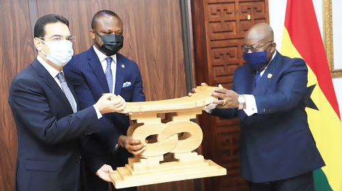 President Akufo-Addo (right) presenting a gift to Mr Emad Magdy Hanna (left), outgoing Egyptian Ambassador to Ghana, at the Jubilee House. With them is Mr Samuel Kumah (2nd left), Director of Protocol. Picture: Samuel Tei Adano