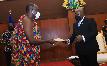 • President Akufo-Addo receiving a report from Nana Otuo Siriboe II, Chairman of the Council of State, during a meeting at the Jubilee House. Picture - SAMUEL TEI ADANO