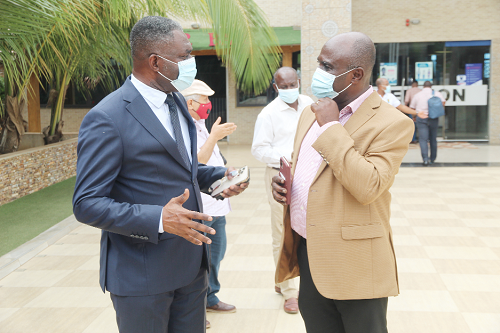 Mr William A. Quaittoo (left), Chief Executive Officer of Tree Crops Development Authority, interacting with Mr Forster Boateng (right), Deputy Chief Executive Officer  in charge of Operations, Food Crops  Development Authority. Picture: ESTHER ADJEI