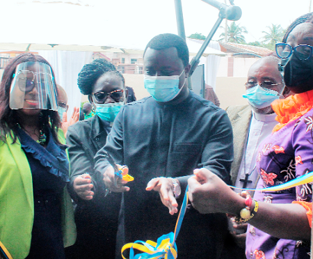 Rev John Ntim Fordjour (middle), a Deputy Minister of Education, cutting the tape to commission Ecole Thérèse Internationale. Assisting are Ms Gifty Twum-Ampofo (right), a Deputy Minister of Education, and Mrs Theodora Wood (left), Principal, Ecole Thérèse Internationale.  Picture: Maxwell Ocloo